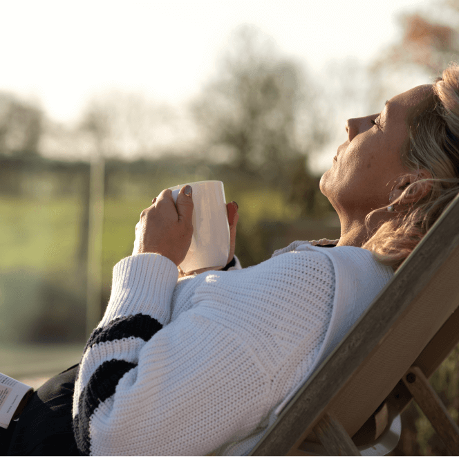 Woman Relaxing Outside at Homefield Grange