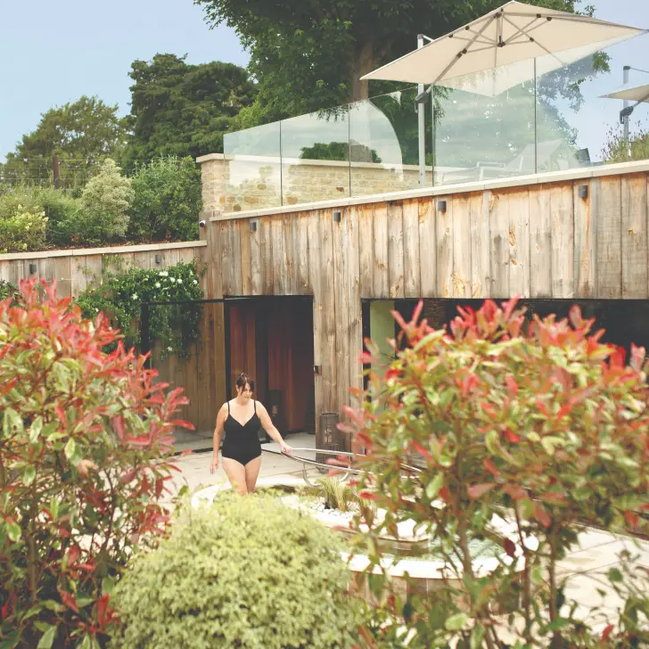 Spa garden at the Living Well Spa, designed as a peaceful outdoor wellness space surrounded by natural planting.
