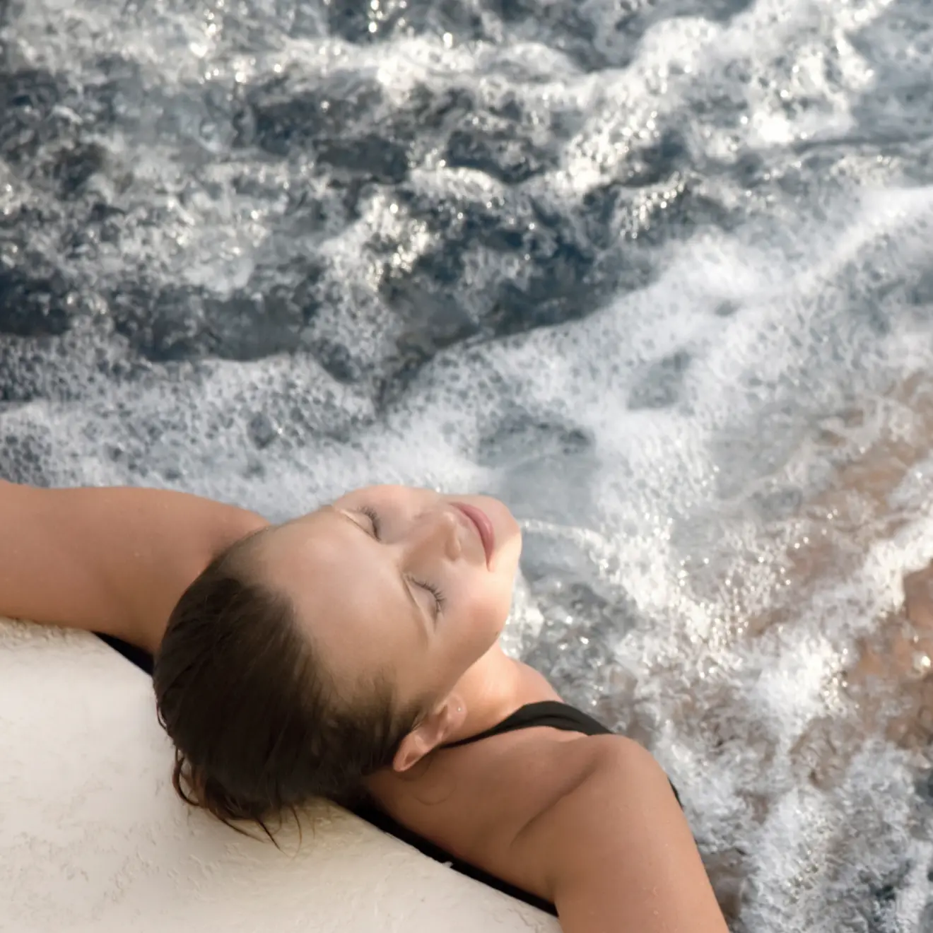 Guest relaxing in warm spa water during the Blissful Bathe & Breathe wellness spa day at Homefield Grange.