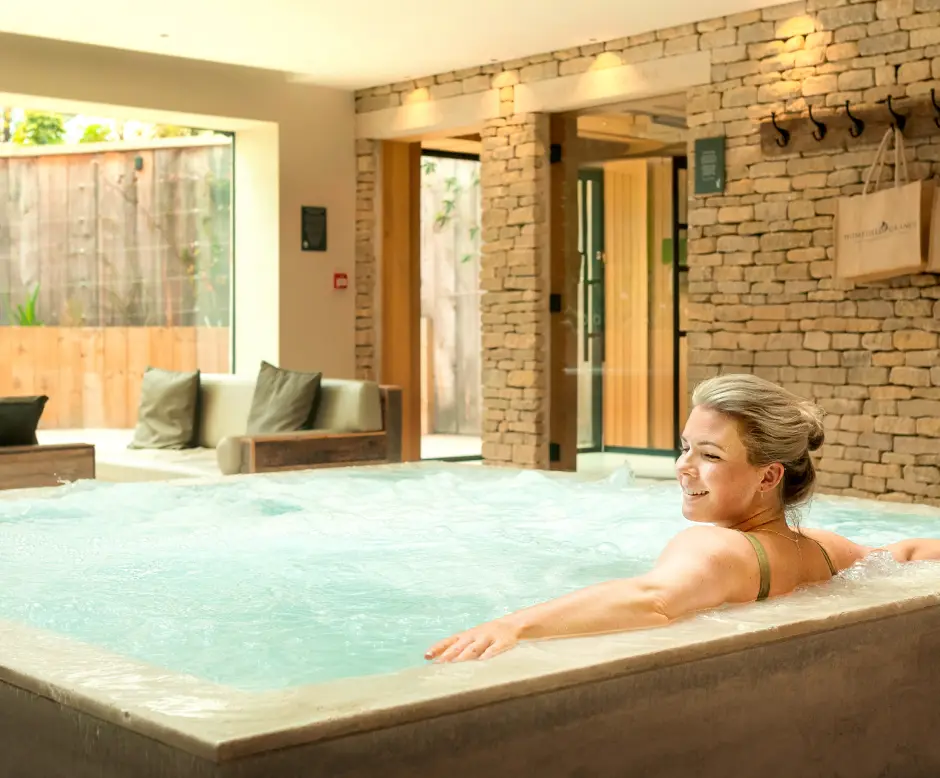 Guest relaxing in the Living Well Hydrotherapy pool during a weight loss detox retreat