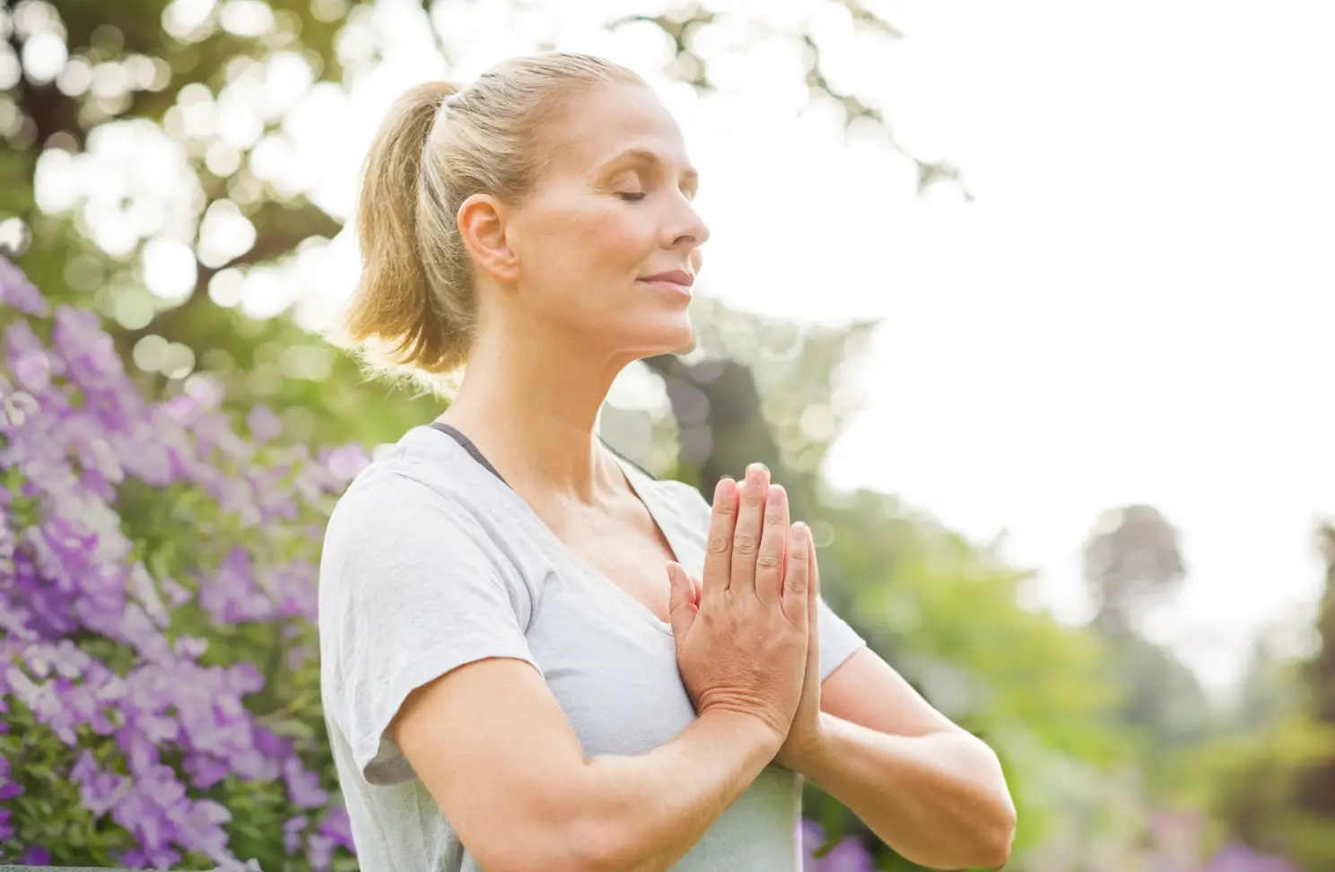 Woman pausing outside during a mind and body reset retreat at Homefield Grange