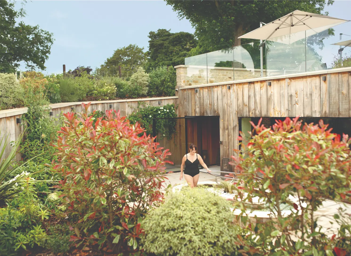 Guest enjoying the outdoor spa garden during a private retreat at Homefield Grange