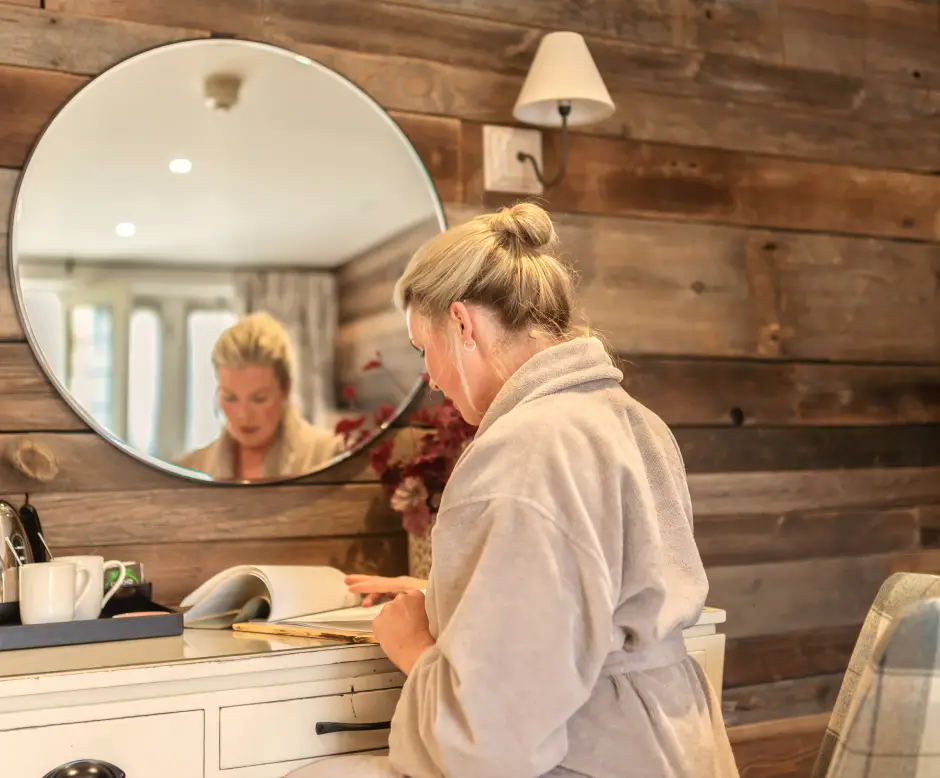 Guest relaxing in her room during a health and wellness retreat at Homefield Grange