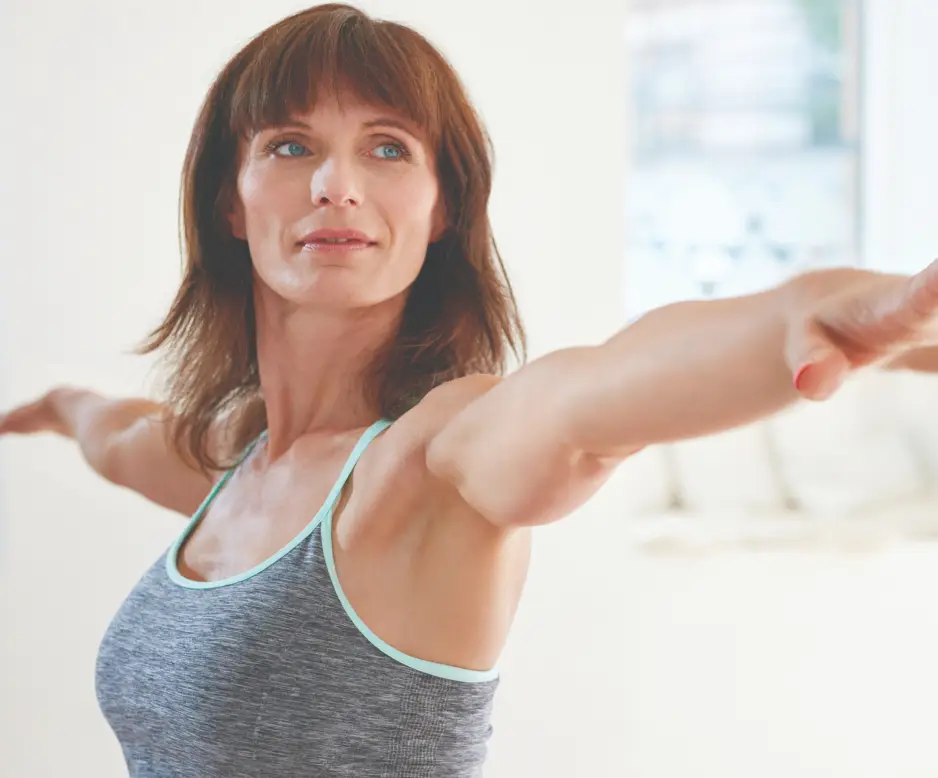 Woman practising yoga during a wellness retreat at Homefield Grange