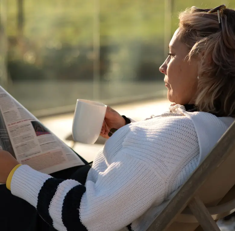 Guest relaxing with a drink during a corporate retreat at Homefield Grange
