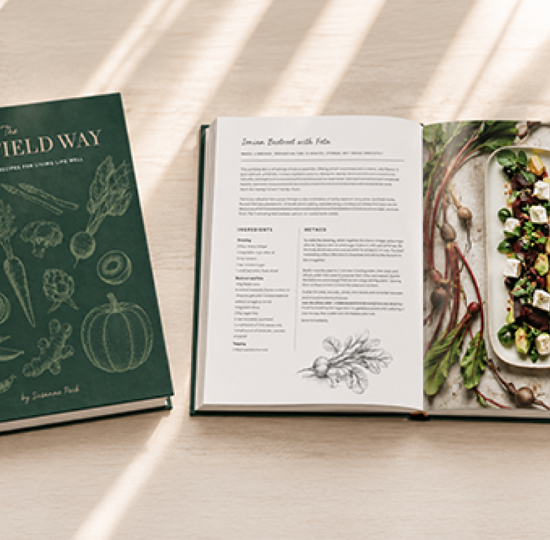 The Homefield Way cookbook by Suzanne Peck with an open recipe spread.